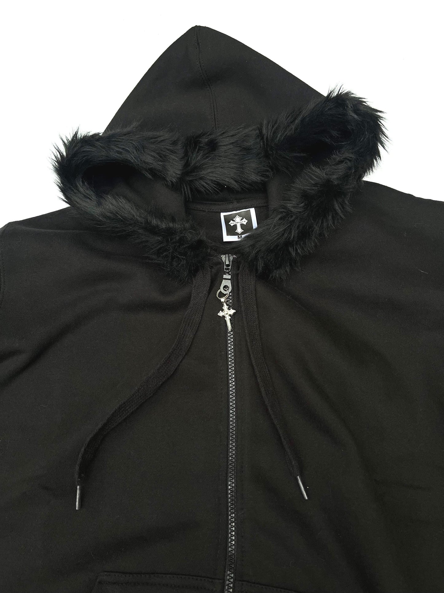 Close up of zip and charm on Black Zip Up Fur Studded Hoodie with Cross Charm